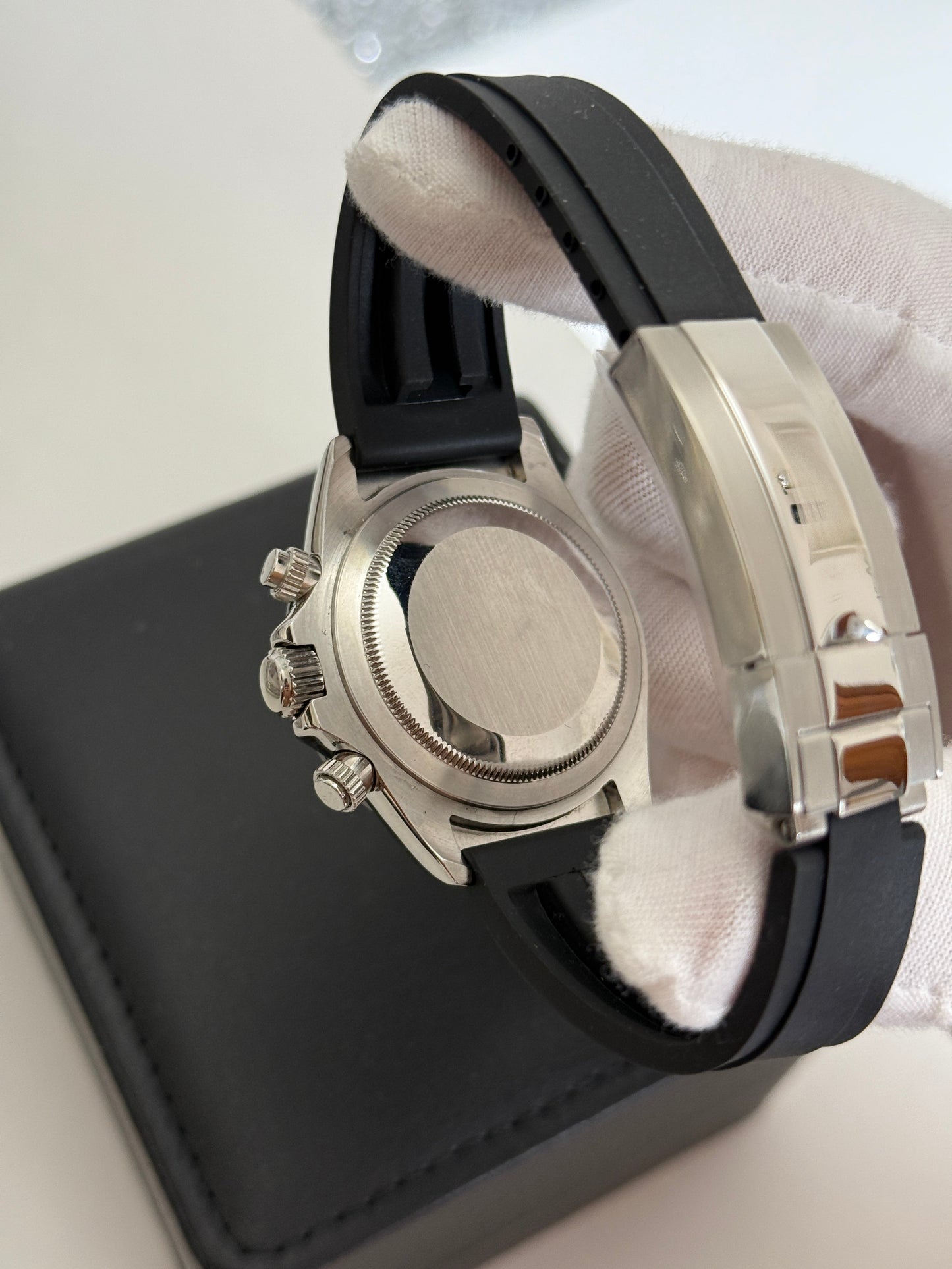 Daytona (Panda) Seiko VK63 meca-quartz chronograph mod watch. A caseback and clasp detail shot showing a plain metal caseback and a silver metal folding clasp.