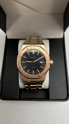 Royal Oak (Rose Gold) Seiko NH35 automatic mod watch. A front view shows the rose gold watch with a black dial centered inside an open black display box.