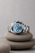 Daytona (Ice Blue Black Bezel) Seiko VK63 meca-quartz chronograph mod watch. A light blue dial watch with a black bezel and metal link bracelet is shown in a full product shot.