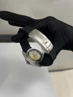 Yacht-Master (Grey) Seiko NH35 automatic mod watch. A caseback detail showing the mechanical movement of the watch held by a gloved hand.