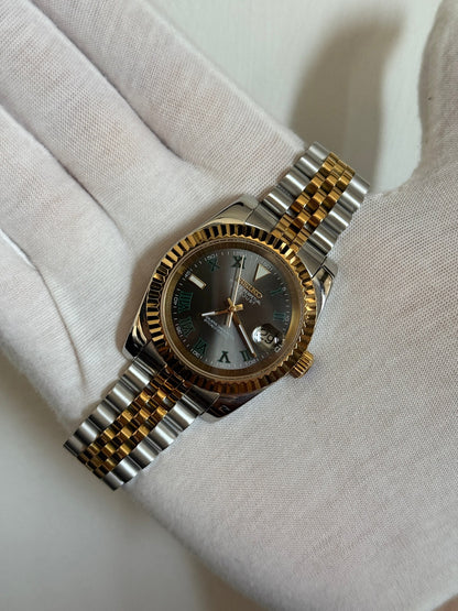 Datejust (Wimbledon Two-Tone) Seiko NH35 automatic mod watch. A hand in a white glove holds the watch showing the dark grey dial and gold fluted bezel on a two tone bracelet.