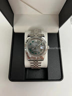 Datejust (Wimbledon Grey) Seiko NH35 automatic mod watch. A full watch with a dark grey dial and silver fluted bezel in a box with a white pillow.