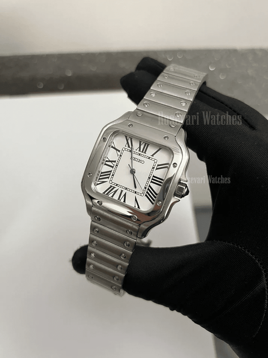 Santos (White) Seiko NH35 automatic mod watch. A white dial watch with a silver bezel and metal link bracelet held in a gloved hand at an angle.