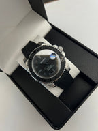 Yacht-Master (Grey) Seiko NH35 automatic mod watch. A full watch with a black dial and bezel on a black rubber strap inside a watch box.