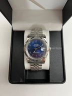 Datejust (Arabic Royal Blue) Seiko NH35 automatic mod watch. A blue dial watch with a silver fluted bezel and jubilee bracelet inside an open watch box.