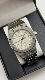 Royal Oak (White) Seiko NH35 automatic mod watch. A silver dial watch with a silver bezel and integrated metal bracelet shown in a full angled shot.