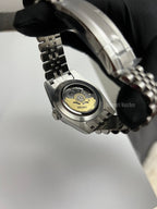 Datejust (Arabic Blue) Seiko NH35 automatic mod watch. A caseback detail shot showing the internal mechanical movement of the watch with a metal link bracelet.