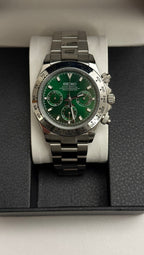 Daytona (Green) Seiko VK63 meca-quartz chronograph mod watch. A green dial watch with a silver bezel and metal link bracelet inside an open black display box.