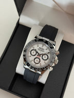 Daytona (Panda) Seiko VK63 meca-quartz chronograph mod watch. A high angle full watch shot in a box showing a white dial with black sub dials and a black bezel.