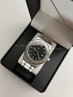 Royal Oak (Black) Seiko NH35 automatic mod watch. A black dial watch with a silver bezel and metal link bracelet inside an open watch box.
