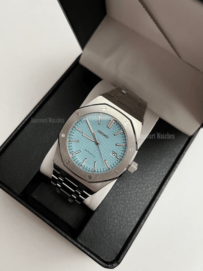 Royal Oak (Light Blue) Seiko NH35 automatic mod watch. A light blue dial watch with a silver bezel and metal bracelet inside a watch box.