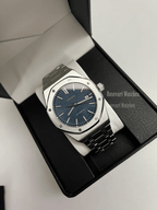 Royal Oak (Blue) Seiko NH35 automatic mod watch. A full watch shot inside a box showing a blue textured dial and silver bezel on a metal link bracelet.