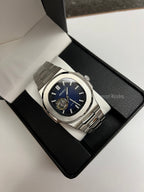 Nautilus (Open Heart, Royal Blue) Seiko NH38 open-heart automatic mod watch. A full watch shot in a box showing a blue dial and silver bezel with a metal link bracelet.