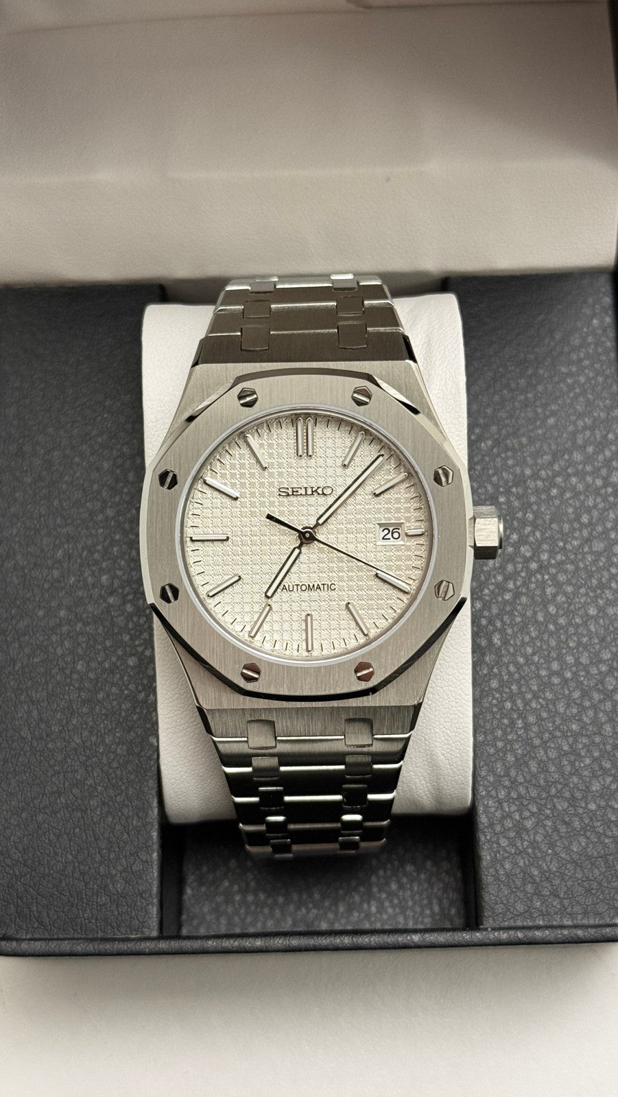 Royal Oak (White) Seiko NH35 automatic mod watch. A silver dial watch with a silver bezel and integrated metal bracelet shown in a full front view.