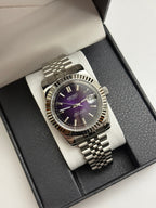 Datejust (Purple) Seiko NH35 automatic mod watch. A full watch shot inside a box featuring a purple dial with a silver fluted bezel and silver bracelet.